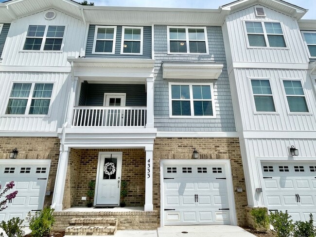 Building Photo - Practically New & Available NOW! Americana Luxury Townhomes! Pet Friendly! Attached Garage! All A...