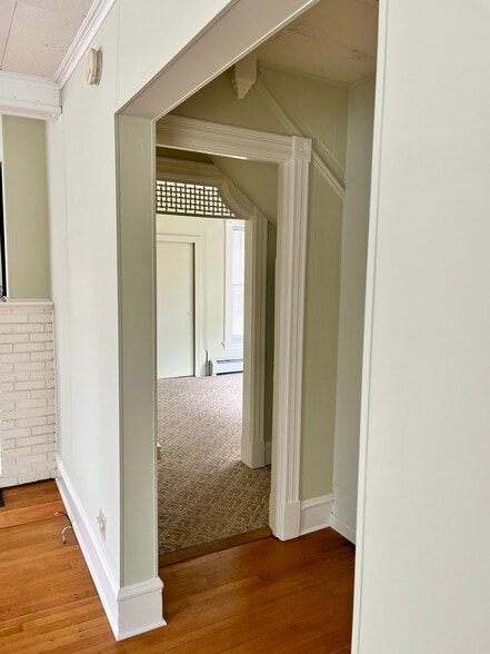 View into bedroom from living room. Closet #1 is on the right before going into bedroom. - 114 Buell St
