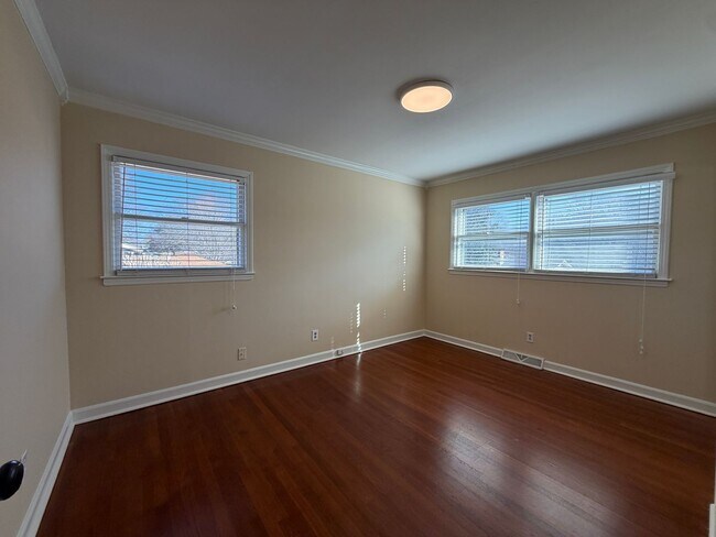 Building Photo - Freshly Painted Split-Level Home with Large Deck & Lawn Care Included