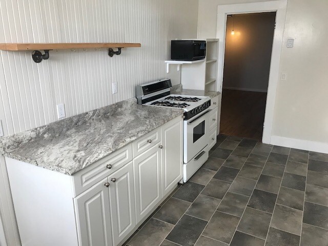 Kitchen looking through to the living area - 1303 44th Ave SW