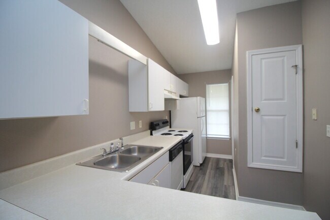 Building Photo - 2BR Patio Home with LVP Flooring, Private Fenced Yard, & Convenient Blue Angel Pkwy Location Near...