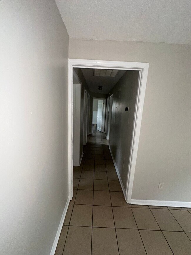 Building Photo - ONE LEVEL BRICK RANCHER WITH EXTRA LARGE LOT