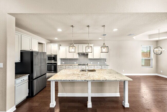 Building Photo - No Rear Neighbors, 3 Car Garage, a Chef's Kitchen, and Room for Everyone