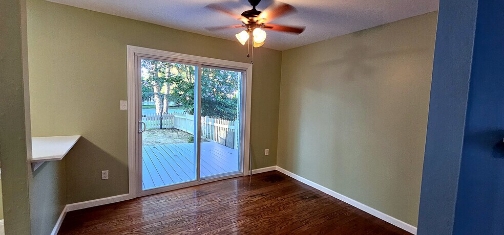 Sun-Drenched Dining Space | Dedicated dining area with a ceiling fan, hardwood floors - 43 Tynemouth Ct