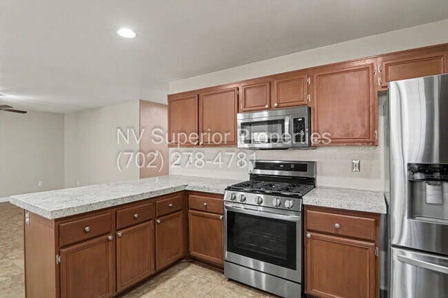 Building Photo - NW!! 4 bedrooms!! Bed & Bath DownStairs!!! RV Parking!!! Synthetic Grass Front yard!! Real Grass ...