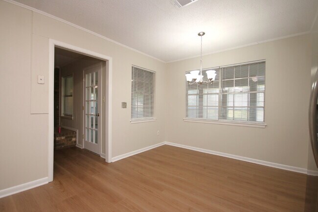 Building Photo - Fully Renovated 3BR/2BA Molino Home on a Spacious Lot Featuring Multiple Living Areas, Sunroom & ...