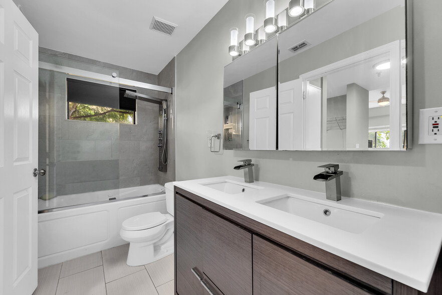 Double sinks, deep tubs - 8816 Collins Ave