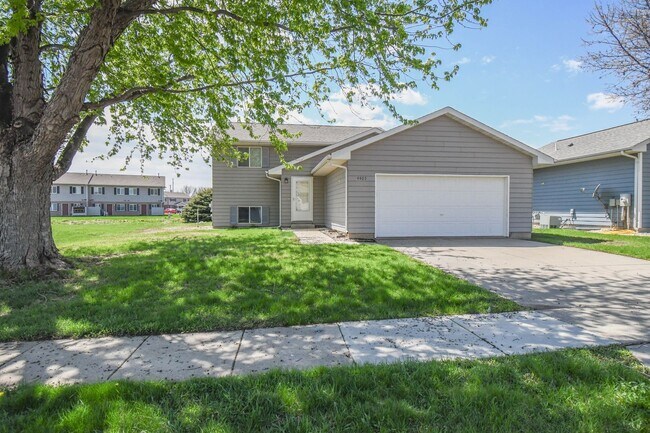 Building Photo - Updated 3BR Split-Level Home with Huge Deck, Fenced Yard & 2-Car Garage Near I-29!
