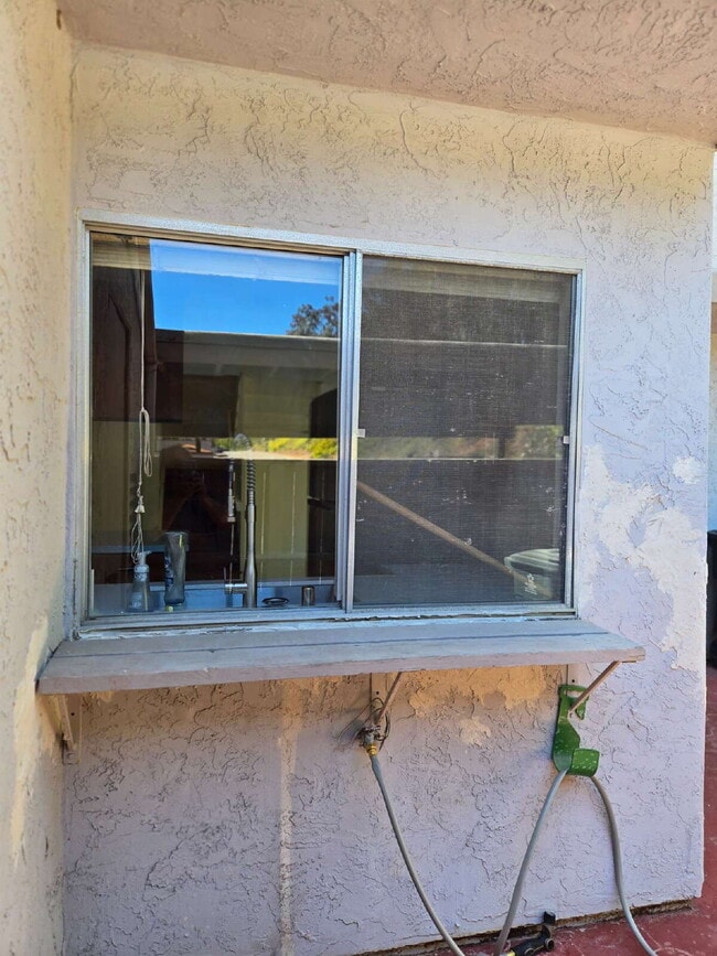 Building Photo - A spacious 3-bed, 2-bath condo is convenie...