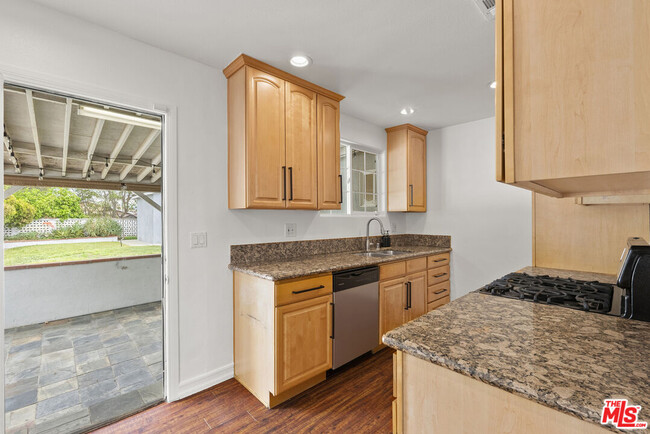 Building Photo - 7560 Irvine Ave