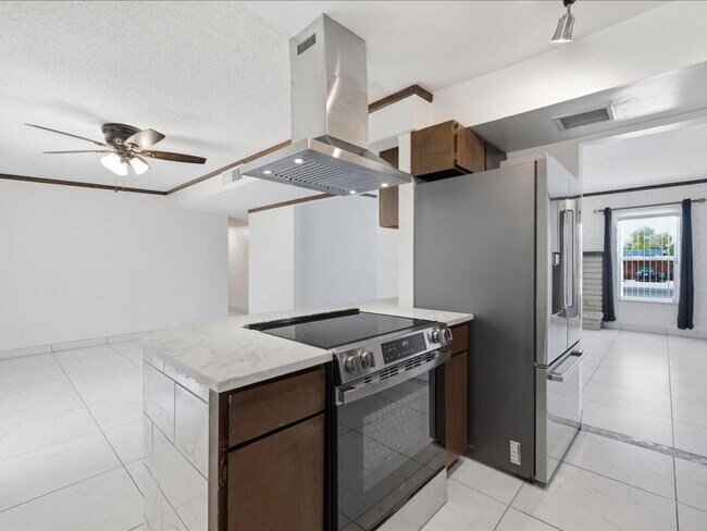 Building Photo - Concept Living with Large Enclosed Backyard & Modern Upgrades!