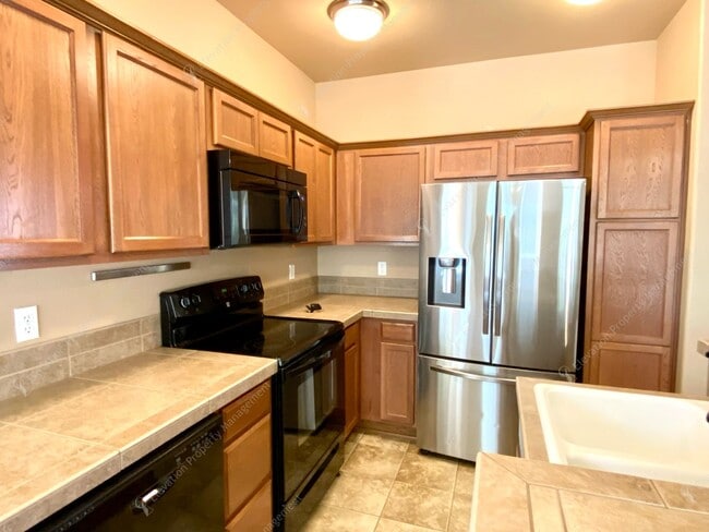Building Photo - 3  BR home with new flooring in a great NE...