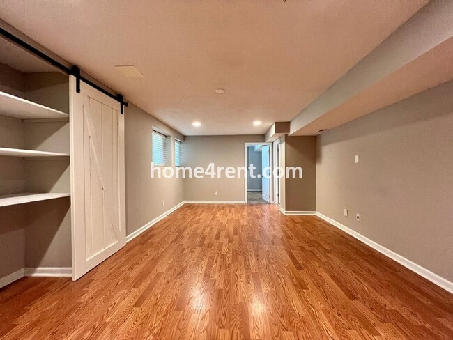 Building Photo - Updated Kitchen, Large Two Tiered Deck, Finished Basement in Blue Valley Schools!