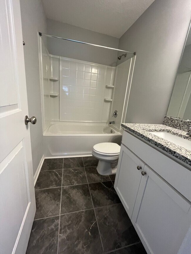 Building Photo - Spacious 4-Bedroom Pet Friendly Home with a Serene View - Available for Rent!