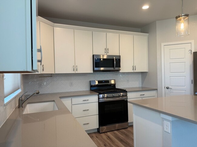 Building Photo - Stunning Luxury Living in Coal Creek with ...