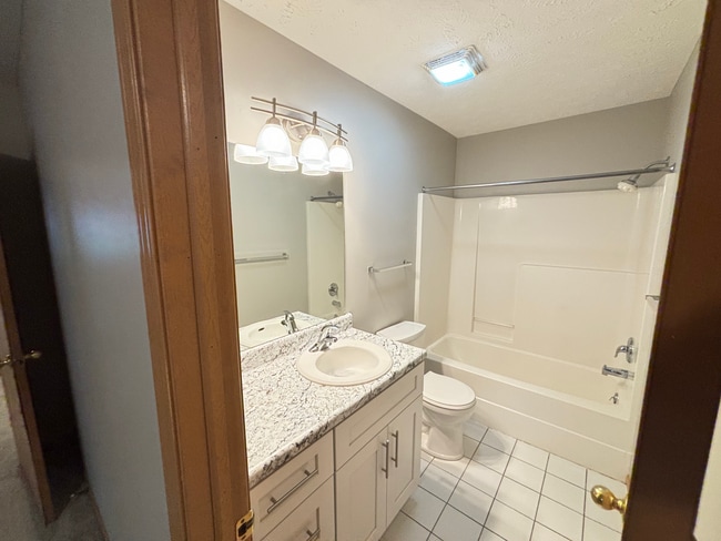 Building Photo - **$300 Off Move In Special** Spacious 3 Bedroom Townhome with Vaulted Ceilings, Fireplace & Attac...