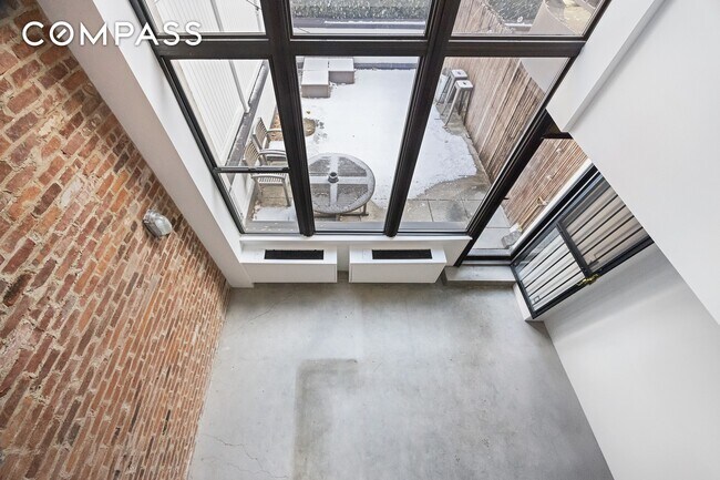 Building Photo - Loft-style one-bedroom with double-height ceilings, oversized windows, and private garden in the ...