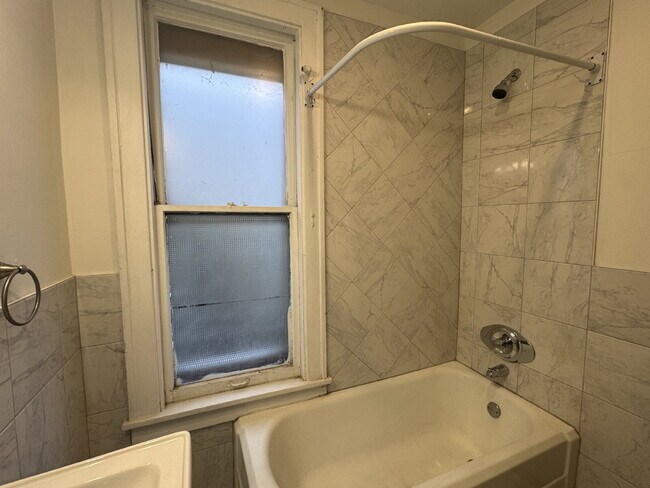 Building Photo - "Spacious 3-Bedroom Minneapolis Gem with Gleaming Hardwood Floors & 2 Full Baths!"