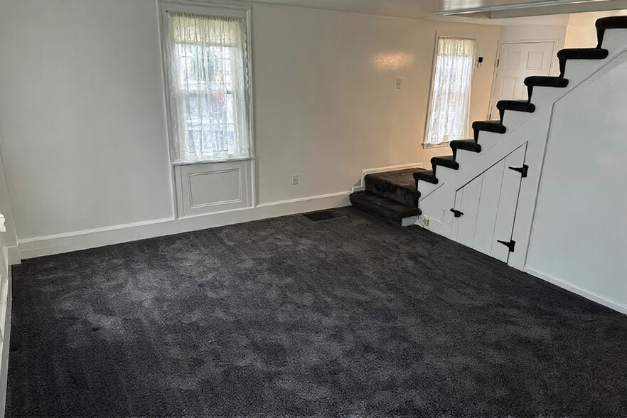 Livingroom; stairs to bedroom and bath - 167 Wilson St