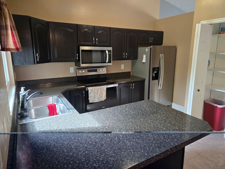 Kitchen with stainless steel appliances - 315 W 750 N