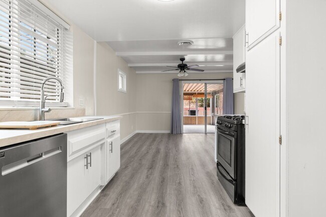 Building Photo - Charming Updated Home With Drive-Through Garage Access