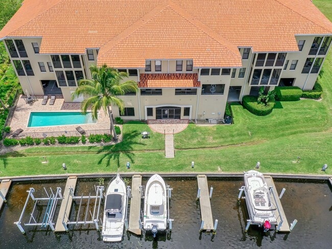 Building Photo - BEAUTIFUL 3-BEDROOM  WATERFRONT CONDO WITH BOAT SLIP AND HEATED POOL