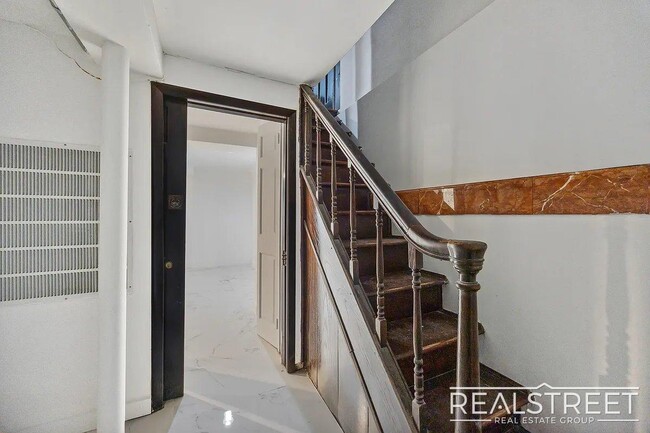 Building Photo - Timelessly Renovated Historic Triplex with...