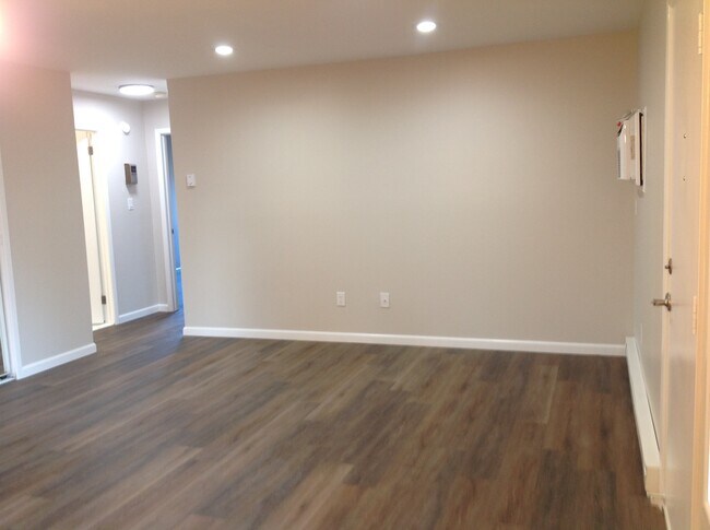 Living room with new flooring - 103 Amberly Dr