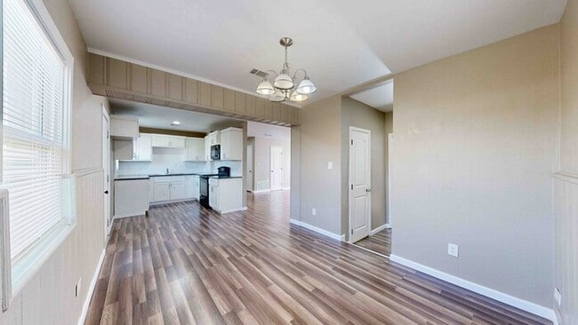 Building Photo - 3 bed 2 bath home with a carport in backyard