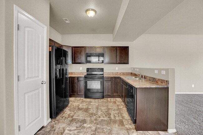 Building Photo - Modern Townhome with Central A/C, 2-Car Ga...