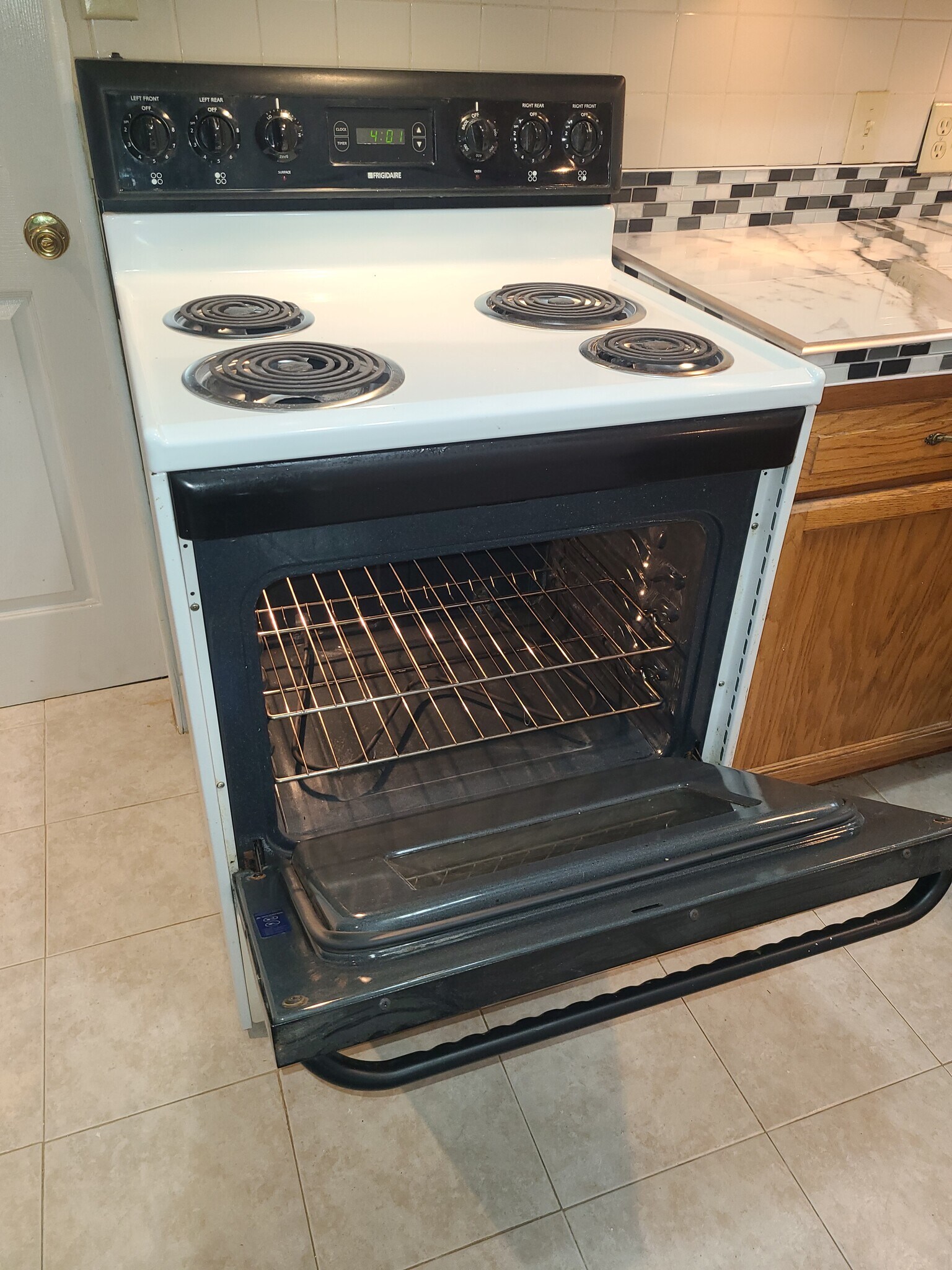 Shiny clean stove with microwave above - 122 Edgerton Rd