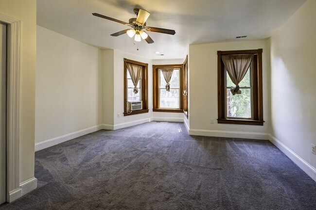 Building Photo - Historic & Charming 3BR Rowhouse near Howard is Move-in Ready!