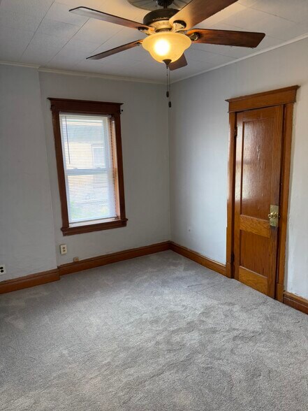 Large living room with hardwood build in shelves and all vintage hardwood - 2346 122nd St
