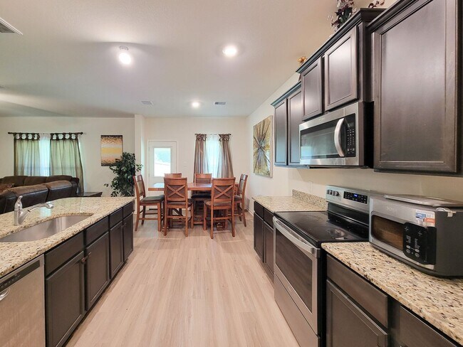 Building Photo - This home is a thoughtfully designed home offering comfort, space, and modern upgrades throughout...