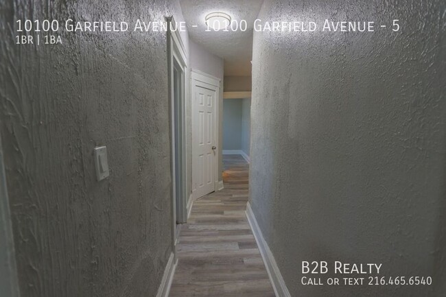 Building Photo - "Charming 1-Bedroom Oasis: Your Perfect Bl...