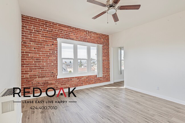 Building Photo - Studio with Exposed Brick Accent Wall, Lot...