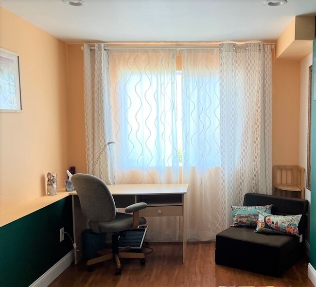 Bedroom 1 - full size bed, upholstered convertible chair-bed, desk, desk chair, large closet - 1627 15th Ave