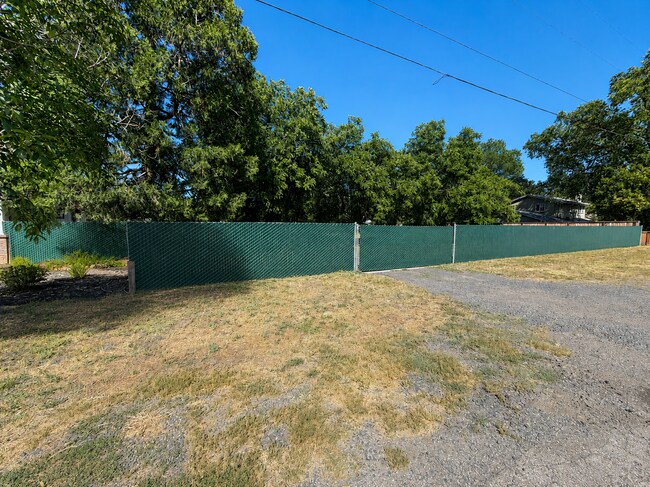 Building Photo - Private 3BR Home on Approx. 1 Acre | Huge Fenced Yard, Sunroom & 2-Car Garage