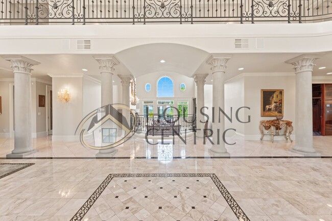 Building Photo - Palatial Executive Home in Custom Guard Ga...