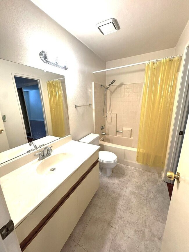Building Photo - 2 Bedroom, 2 Bath Upstairs Condo with Private Balcony & 2-Car Garage, Gated Community, Water/Tras...