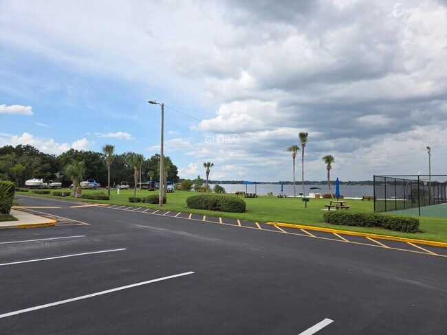 Building Photo - Lakefront First-Floor Condo in Camelot by ...