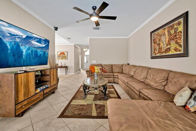 Building Photo - "Stunning 3BR Orlando Home with Private Screened Pool, Spa & Spacious Living Areas"