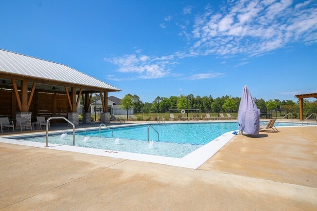 Building Photo - Don’t Miss This 4BR Avalon Home — Modern Interior, Open Floor Plan & Access to Pool, Volleyball &...