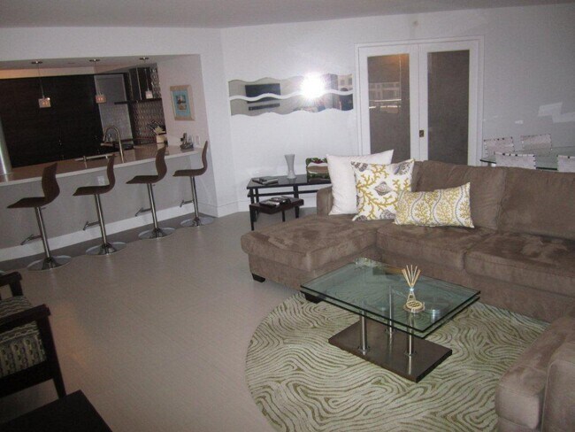 Living Rm w kitchen counter seating - 170 Ocean Lane Dr