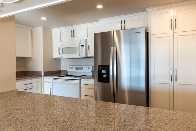 Kitchen with new refrigerator. Refrigerator has a triple-osmosis water filter - 500 N St
