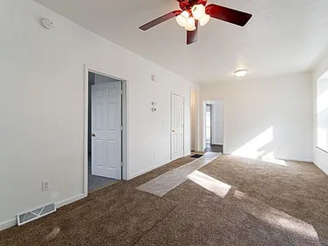 Building Photo - SW 4 bedroom 2 bath with 2 stall garage ne...