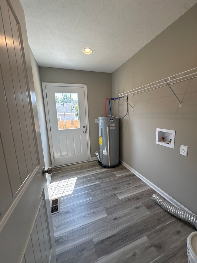 Building Photo - Charming New Home with a Rocking Chair Front Porch!