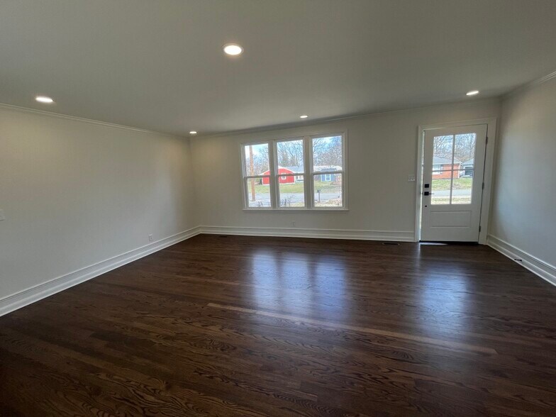 Living room with fresh hardwoods. - 623 Dunston Dr