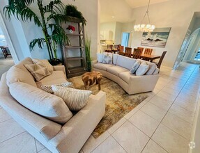 Building Photo - Lakefront Luxury in North Naples – Elegant...