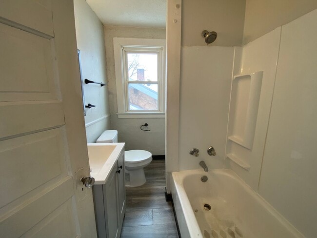 Building Photo - Cozy Akron Home w/ Fireplace Charm, Detached Garage & Back Porch